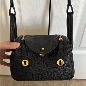 Elegant Black and Gold Mini Bag with Textured Leather